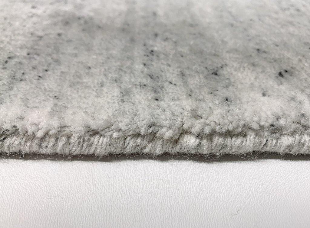 Akita Ivory Flek rug side view white base dark grey flek horizontal texture
