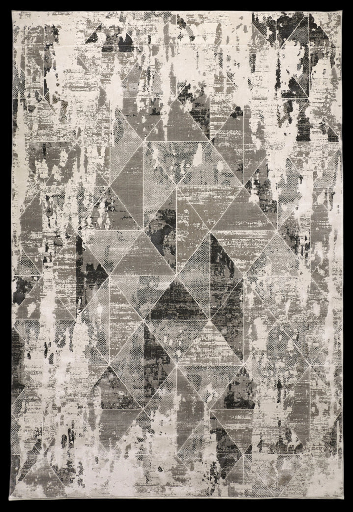 Geometric modern area rug with overlapping triangles in grey, charcoal, and ivory tones from the Ginza Collection