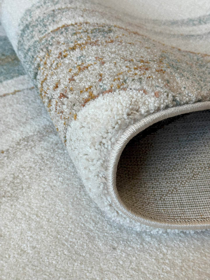 Arlo 2962 abstract area rug with green, teal, and burnt orange over a neutral base