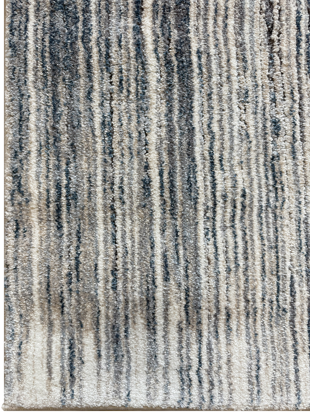 Modern soft area rug with coastal-inspired palette and linear texture
