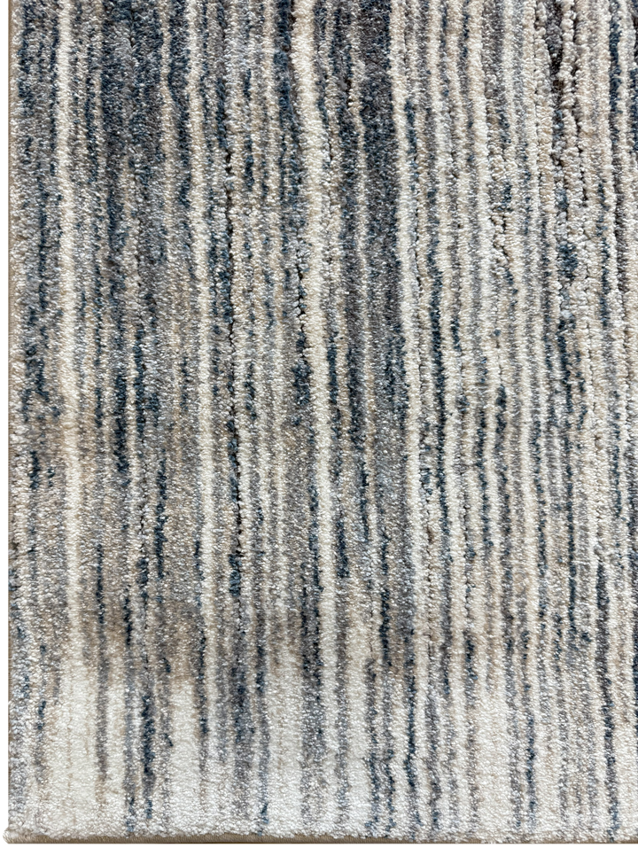 Modern soft area rug with coastal-inspired palette and linear texture