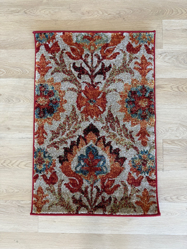 Southern bold rugs with red, teal, and taupe distressed floral pattern on textured polypropylene pile