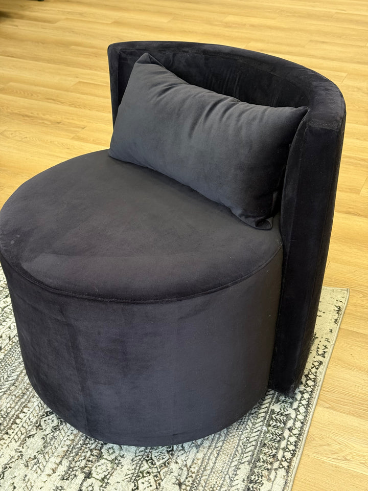 Black Audrey Swivel Chair upholstered in soft suede fabric, featuring a modern design with a 360-degree swivel base for added comfort and versatility.