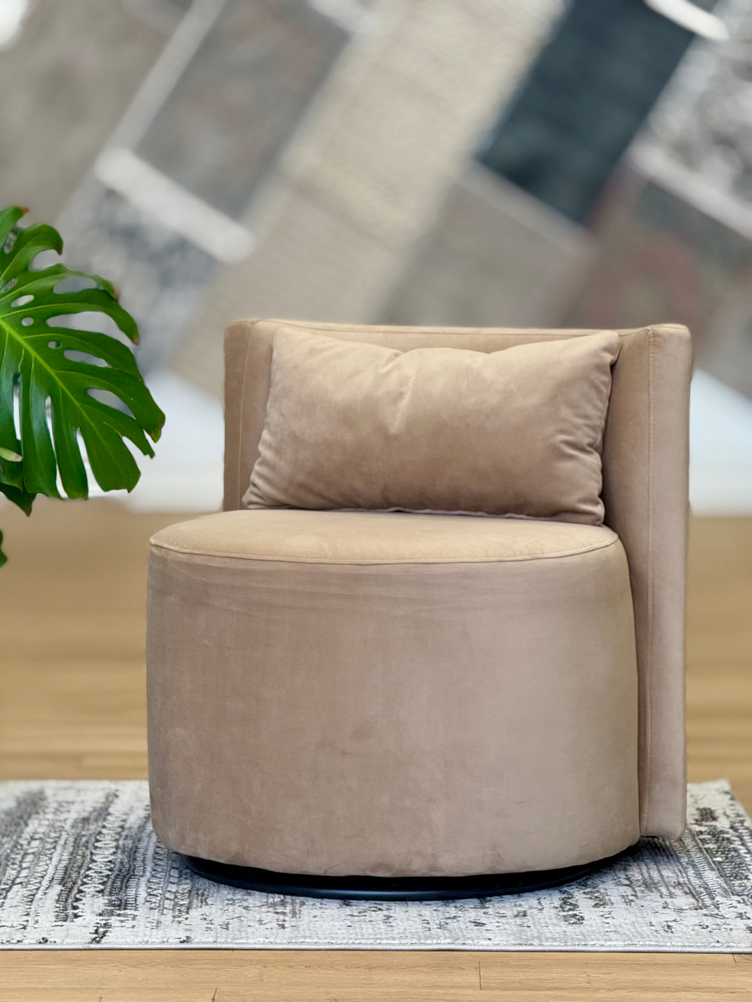 Tan Audrey Swivel Chair upholstered in soft suede fabric, featuring a modern design with a 360-degree swivel base for enhanced comfort and style