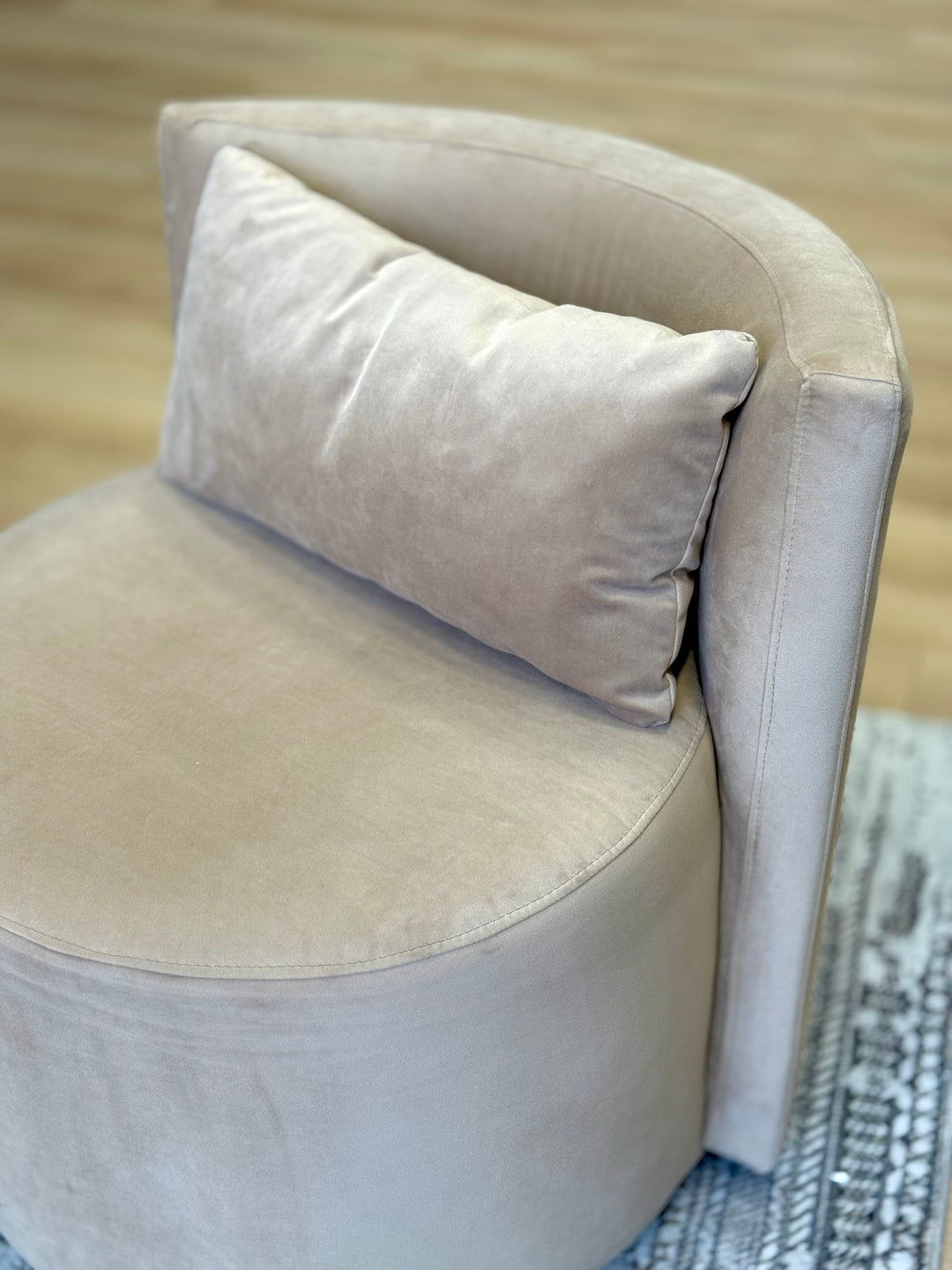 Tan Audrey Swivel Chair upholstered in soft suede fabric, featuring a modern design with a 360-degree swivel base for enhanced comfort and style