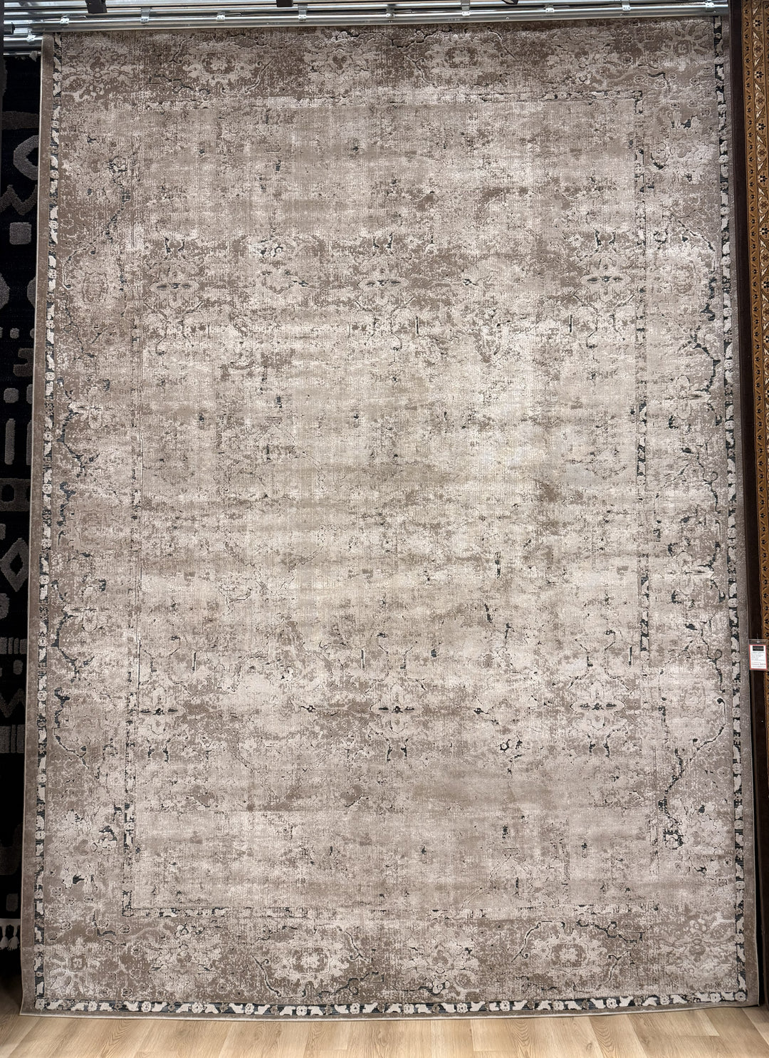 Tallia 597 area rug in layered brown tones with indigo blue and charcoal accents, polypropylene construction