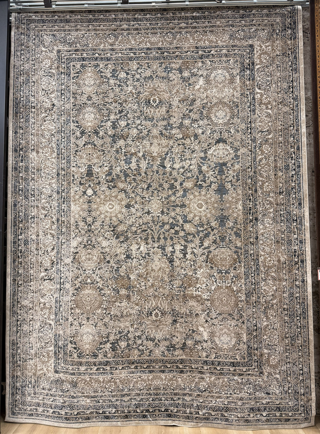 Tallia 935 area rug with traditional distressed pattern in grey and charcoal tones