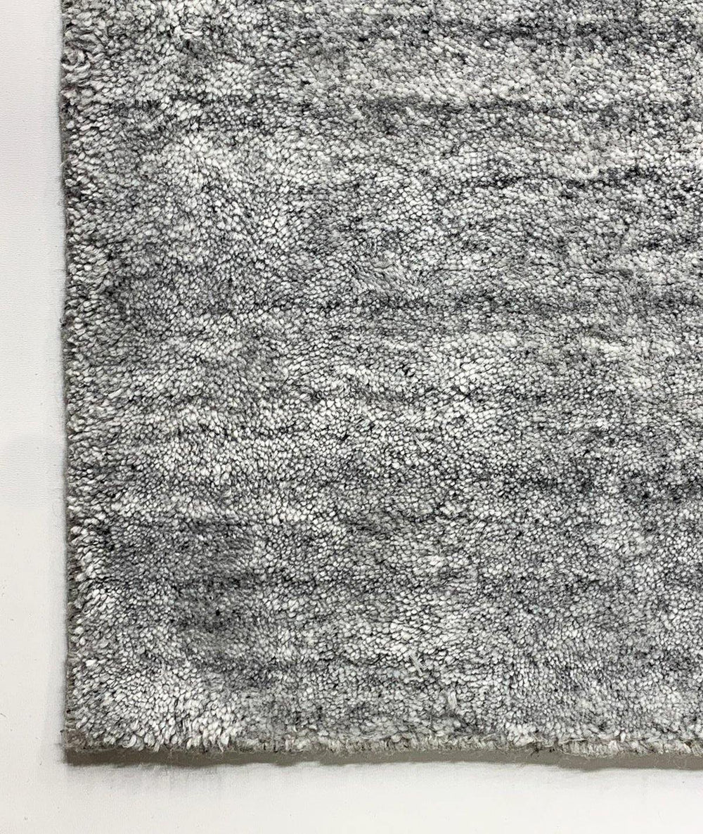 Akita Light Grey rug corner view light grey base dark grey flek horizontal texture