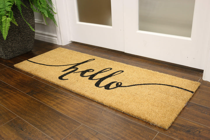 Coconut fibre welcome mat with "hello" written in cursive 